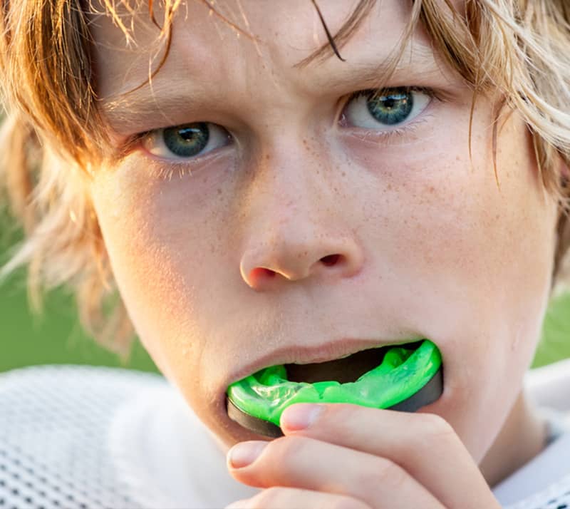 boy wearing sport mouth guard