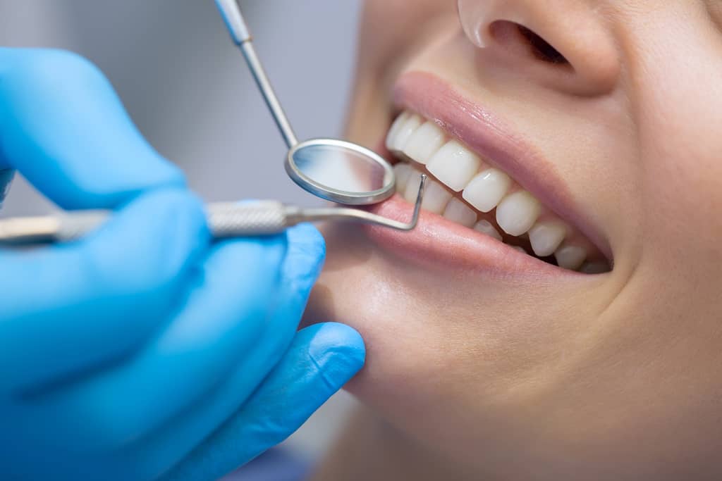 girl recceiving dental cleaning