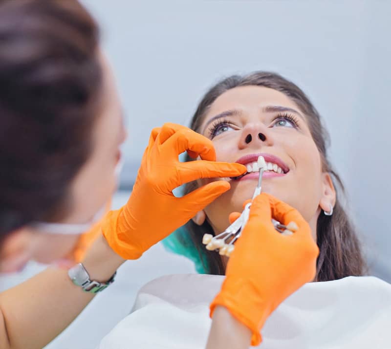 girl receiving porcelain veneer