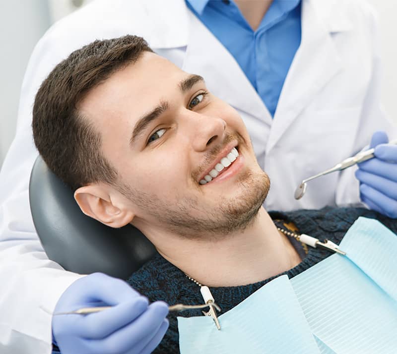 patient smiling before getting dental crown
