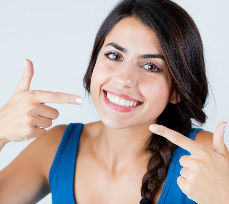 smiling girl showing whitened teeth
